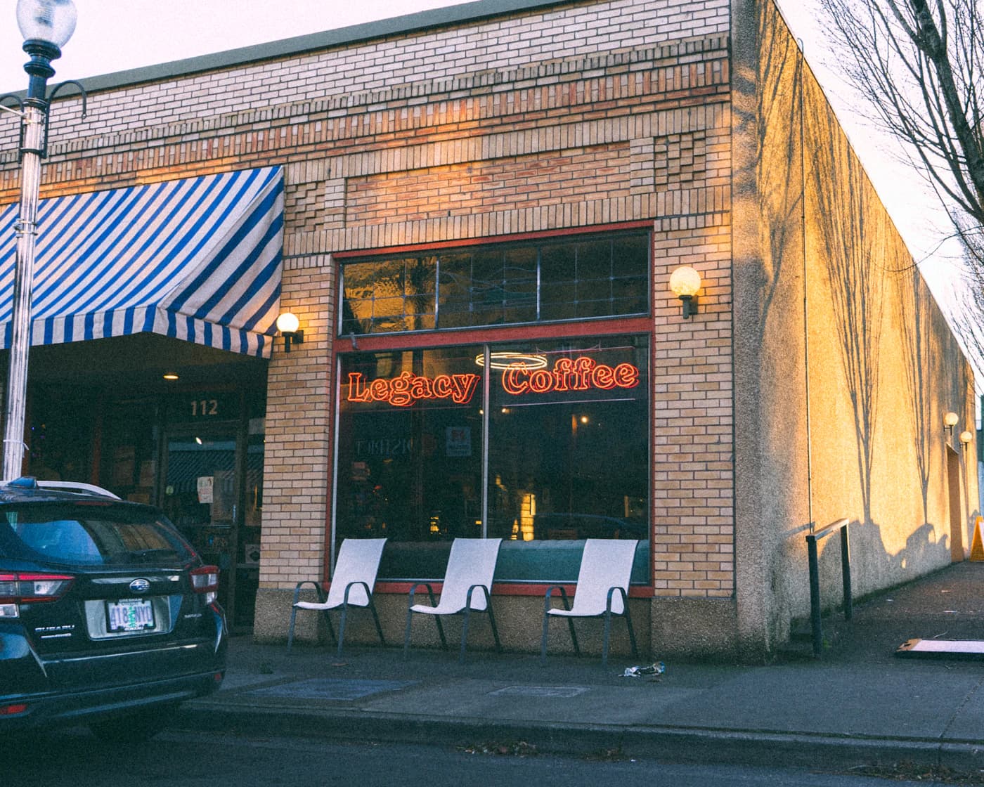 Independent local business storefront with outdoor seating