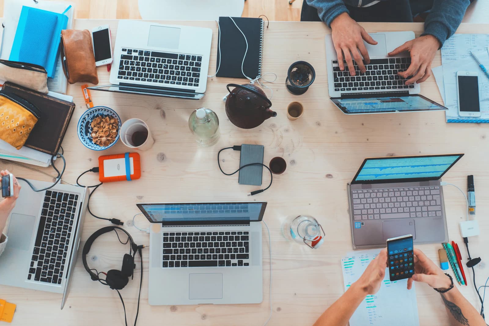 Technology team collaborating around a shared workspace