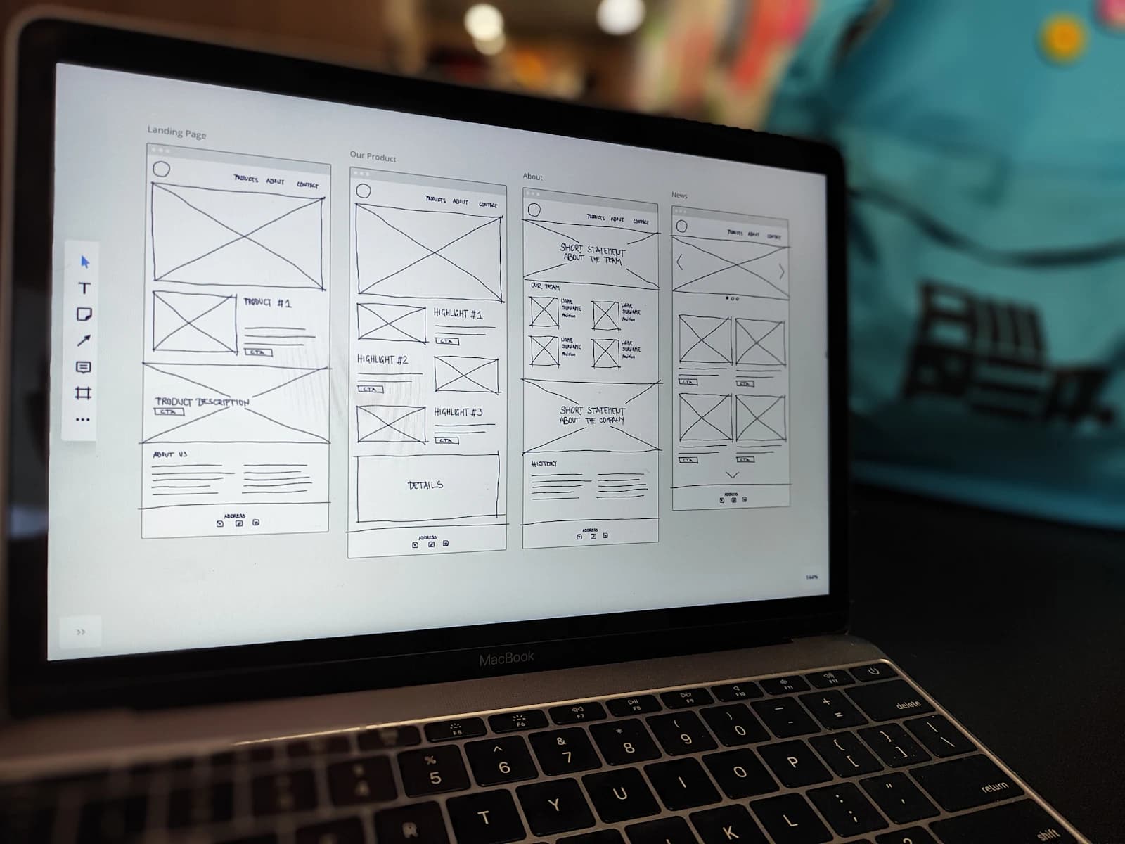 Website wireframes displayed in a professional design workspace